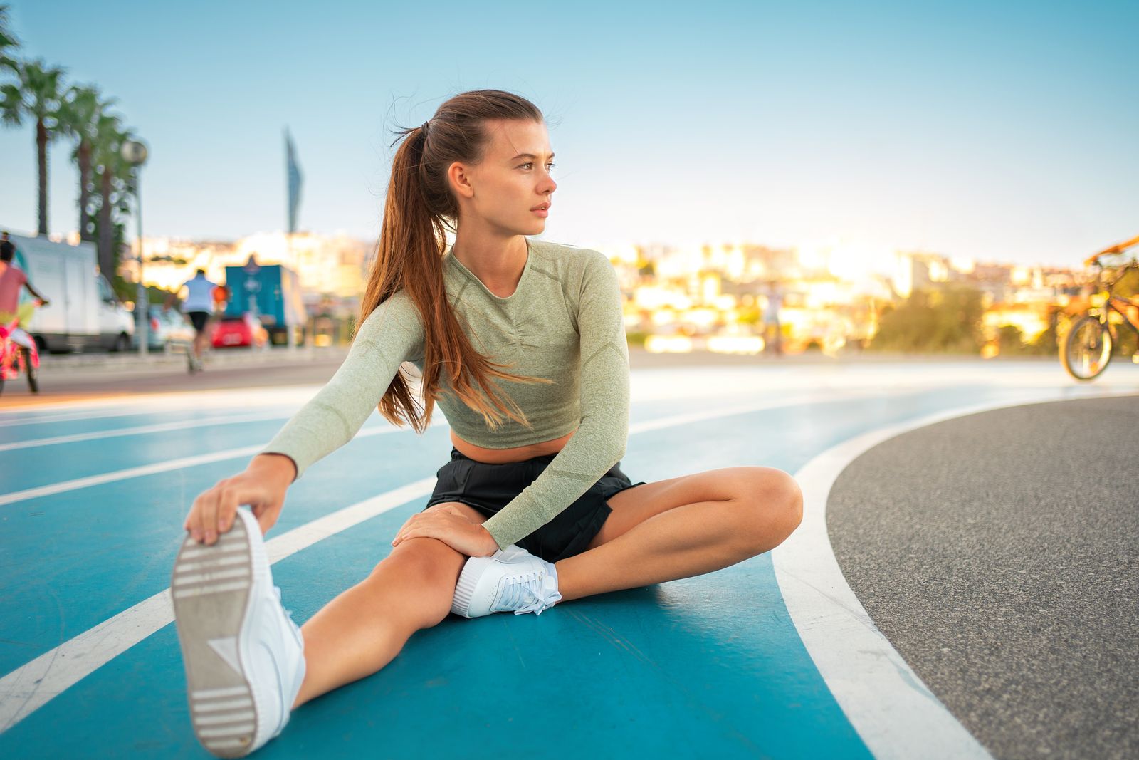 woman stretching, pre workout, post workout